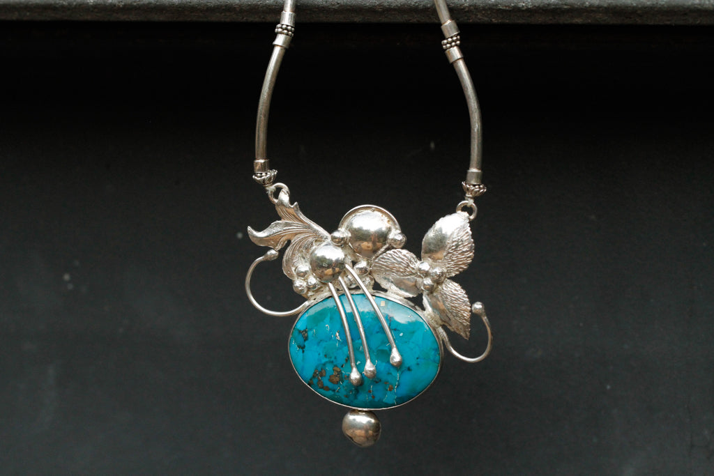 turqouise encased flower - n013