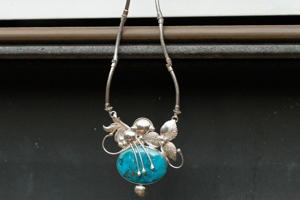 turqouise encased flower - n013