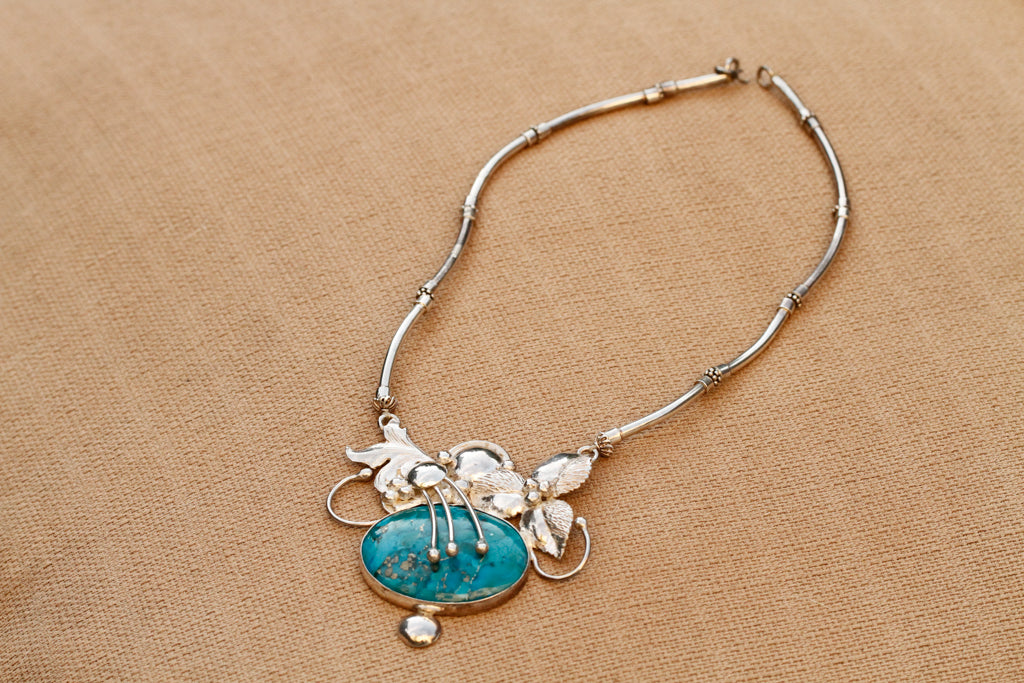 turqouise encased flower - n013